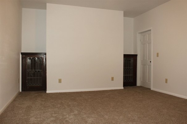 Den with Built-In Antique Cabinets